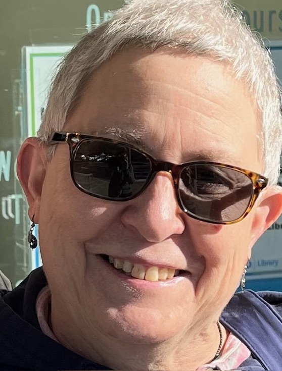 color photo of the author 2024, age 69, wearing sunglasses, with short gray-white hair